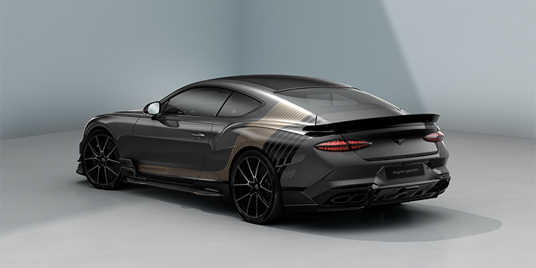 Bentley Düsseldorf Bentley Supersports rear three quarter in "Nightfall Design theme with Anthracite paint and Beluga black and Camel brown paint stripes across the rear haunch.